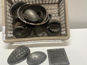 A job lot of metal Victorian chocolate moulds
