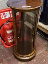 An unusual cylinder shaped glazed display cabinet (no shipping available)