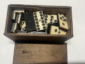 A box of antique bone dominoes