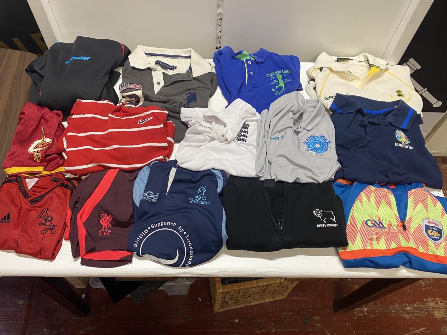 A job lot of mixed sports shirts