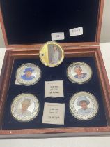 A cased set of commemorative coins