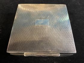 A hallmarked silver Art Deco period cigarette box with boxwood lining