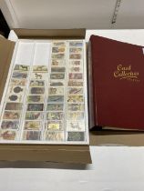 A card collectors society folder full of reprint cigarette cards