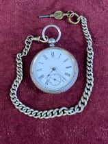 A hallmarked silver gents pocket watch with chain and key (slight damage to enamel dial runs