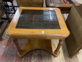 A 1980's coffee table with glass insert, shipping unavailable