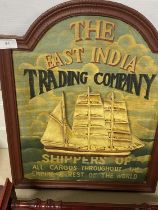 A vintage style wooden sign for The East India Trading Company