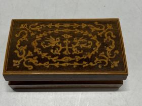 A small wooden box with satinwood inlay