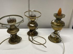 Three oil lamps converted for electric use