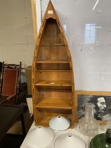 A pine storage unit in the form of a boat, shipping unavailable