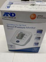 A boxed blood pressure monitor working order