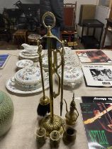 A selection of vintage brass items including fireside companion