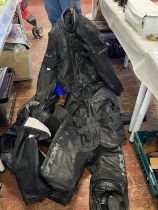 A job lot of assorted motorbike leathers. shipping unavailable.