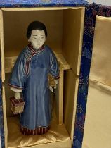 A boxed Chinese ceramic figurine