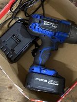 A Hyundai cordless impact wrench in working order with charger