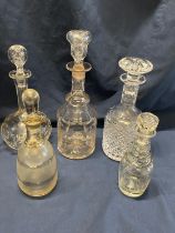 Five assorted glass decanters