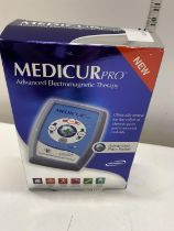 A boxed Medicur pro pain relief machine (untested)