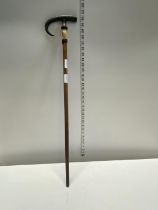 A antique two positioned horn handled walking stick
