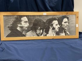 A framed Beatles print 100x37cm, shipping unavailable