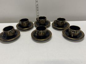 A set of six coffee cups and saucers with 24ct gold details