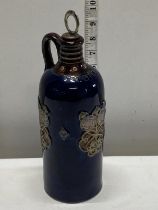 A antique Doulton Lambeth blue glazed ceramic whiskey decanter