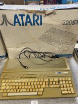 A boxed Atari 520ST console (powers up)