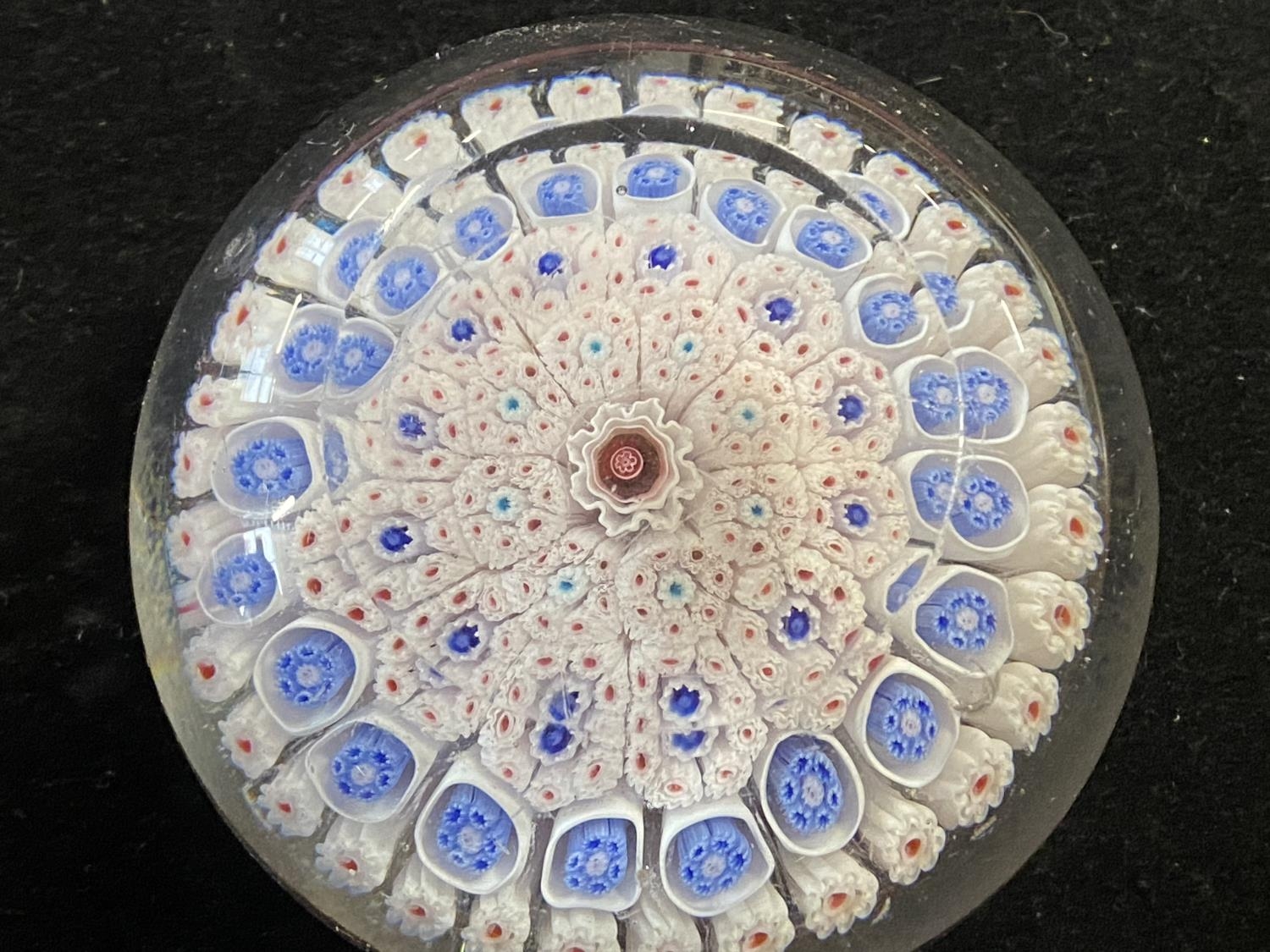 A circa 1850 Bacchus paperweight with millefiori decoration, blue canes with a central red cane