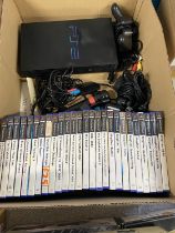 A PS2 console with controllers and a good selection of games (working)