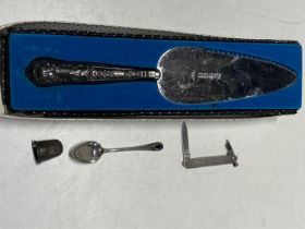 A selection of hallmarked silver items including silver handle cake knife a/f