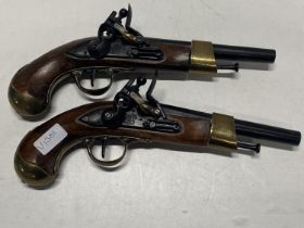 Two good quality reproduction wall hanging pistols