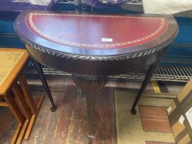 A reproduction mahogany demi lune hall table, shipping unavailable