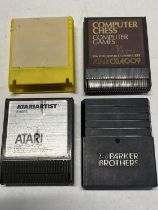 Four assorted Atari gaming cassettes