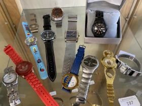 A shelf of assorted time pieces