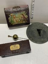 A antique cased Sikes hydrometer, a antique tin and a sun dial