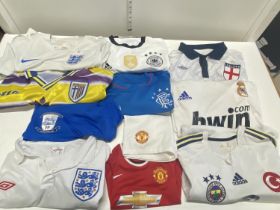A selection of assorted sized Football shirts