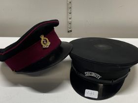 A military RAMC cap and one a vintage security cap