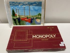 A boxed Monopoly deluxe board game (unchecked) and a ceramic plaque