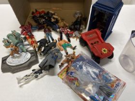 A box of assorted figurines and other models including Dr Who