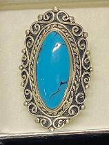 A large 925 silver ring with turquoise stone