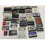 A box of loose spectrum gaming cassettes and other