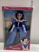A boxed Disney Snow White porcelain doll