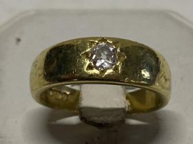 A hallmarked 18ct gold gents ring with a single solitaire diamond with approx 0.35ct 9.86g. Size Q