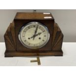 A Art Deco period oak cased mantle clock by Enfield with key and pendulum