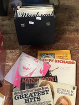 A job lot of mixed genre LP's in carry case shipping unavailable