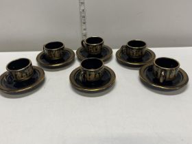 A set of six coffee cups and saucers with 24ct gold detail