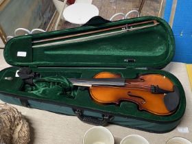 A cased 3/4 size violin with bow & case shipping unavailable