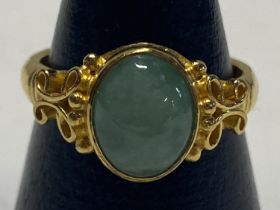 A hallmarked Chinese 22ct gold and Jade stone solitaire ring. 7.36 grams. Size N 1/2.
