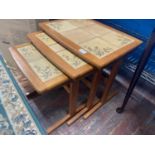 A nest of three mid century teak tables with tile inserts, 53x39cm shipping unavailable