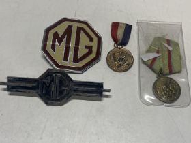 Two medals and two vintage MG car badges