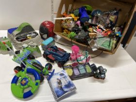 A box of assorted figures and toys etc