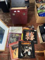 A job lot of mixed genre LP's in carry case shipping unavailable